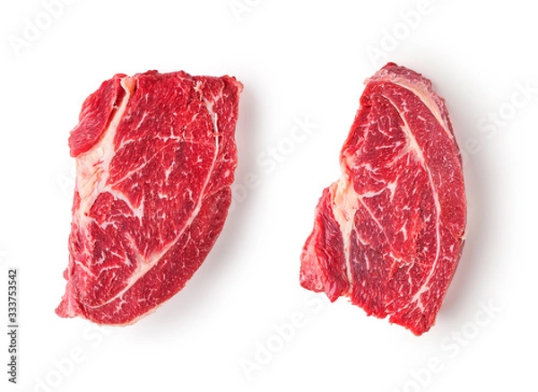 Obraz Two slices of frozen beef meat for steak on a white background.