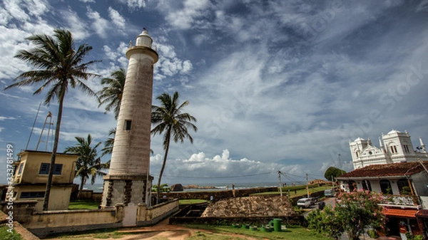 Obraz  Lighthouse and palm trees