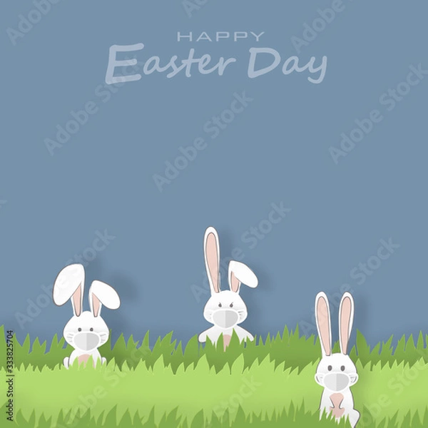 Fototapeta The rabbit hides in the clump of grass. With a mask to protect the virus on Easter day