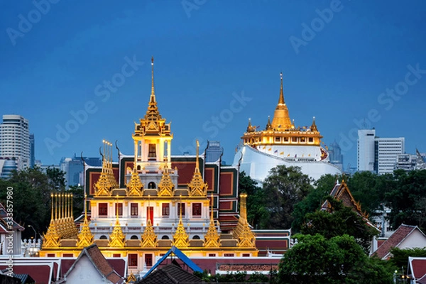 Obraz Golden Metal Castle at Wat Ratchanadda (Loha Prasat) and Gloden Mount at Wat Sraket Rajavaravihara at twilight in Bangkok Thailand.The both famous landmarks Temple and pagoda in Bangkok Thailand.