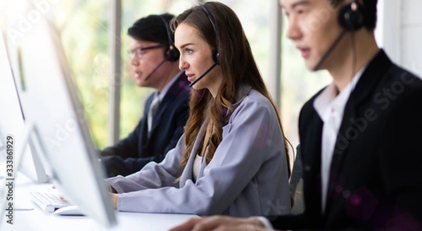 Fototapeta Professional Customer service assistant  team working in call center office.  Communication, telemarketing sale support, call center and helpline concept.