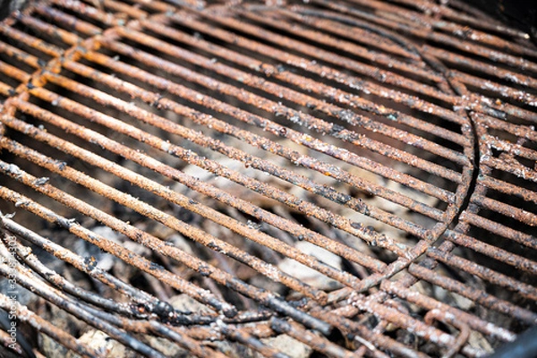 Fototapeta rusty grill rust over coal residues