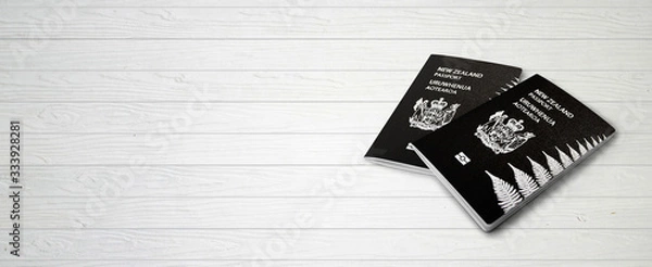 Fototapeta New Zealand Passports on Wood Lines Background Banner with Copy Space - 3D Illustration