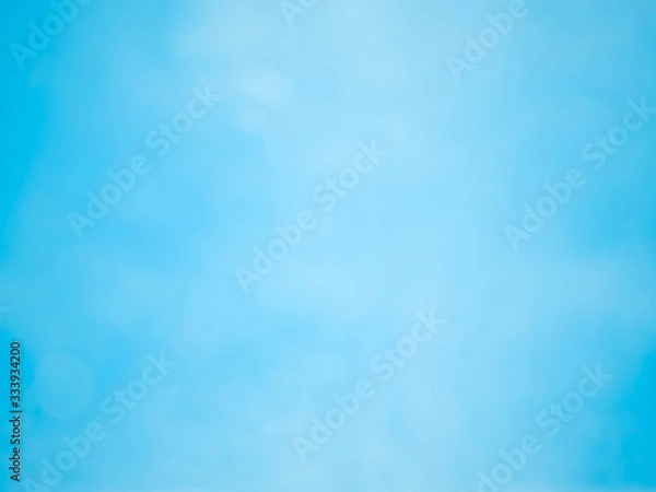 Fototapeta blue background with soft bokeh lights.