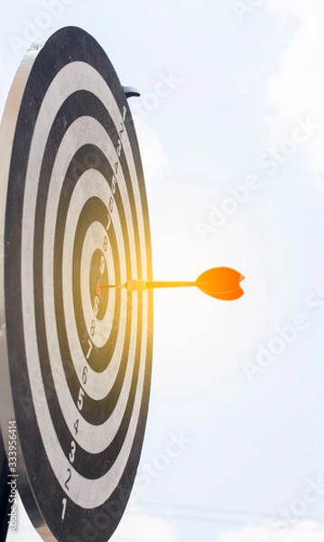 Fototapeta Dart on Dartboard score Achieve winner on target for business concept 