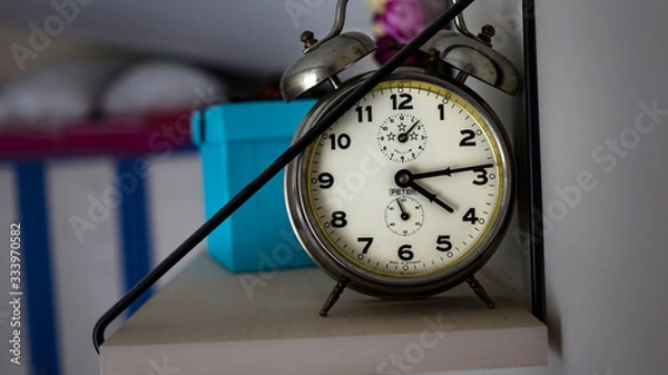 Fototapeta retro desk clock at the shelf