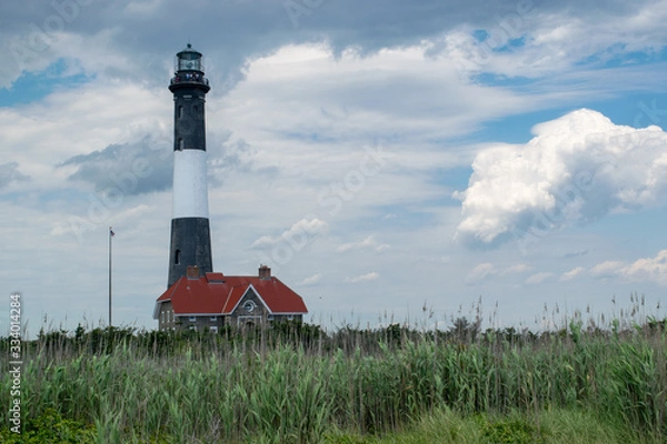 Obraz Lighthouse with Clouds and a Pastel Sky