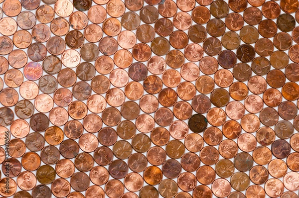 Fototapeta Full frame background of American pennies of varying ages and conditions formed into a neat pattern