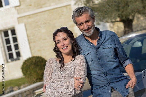 Fototapeta middle-aged couple satisfied with their success