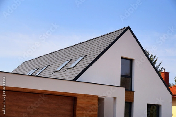 Fototapeta A newly built house. The roof is made of ceramic tiles.