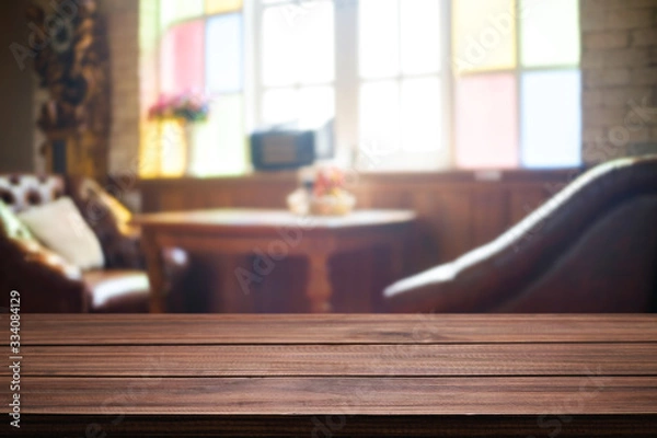 Fototapeta Empty wooden desk space and blurry background of restaurant vintage tone for product display montage.