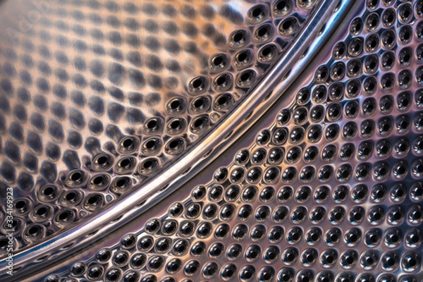 Obraz perforated metallic drum inside the washing machine