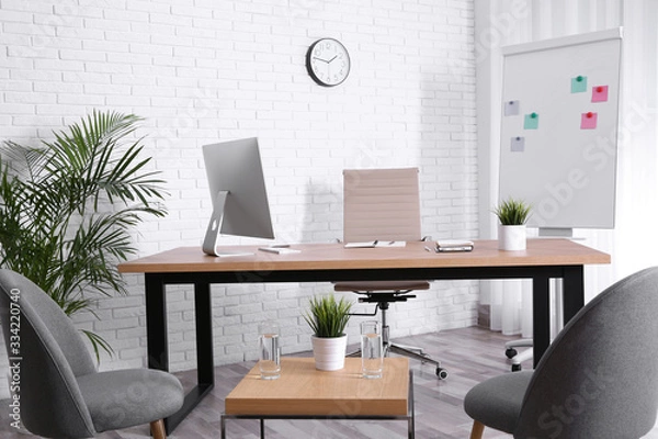 Fototapeta Interior of modern office with table, chairs and computer