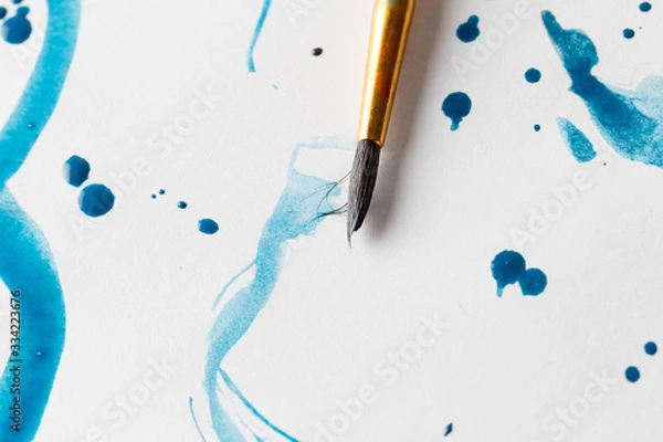 Obraz paint brush paints on paper