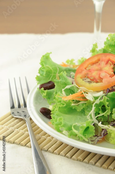 Obraz Fresh salad on diner table