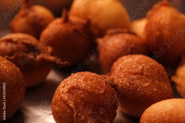 Fototapeta rain cookie - bolinho de chuva fried dough in the shape of balls, tipica do Brasil recipe with cinnamon and sugar