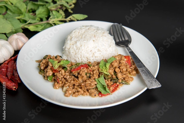 Fototapeta Rice  with stir-fried minced pork and basil.