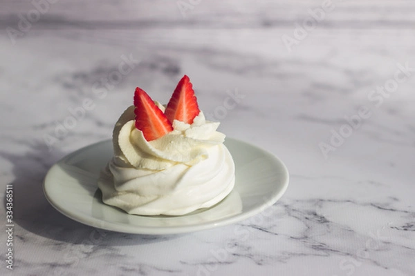 Fototapeta Dessert "Pavlova". Airy crispy meringue, delicate cheese cream and strawberries