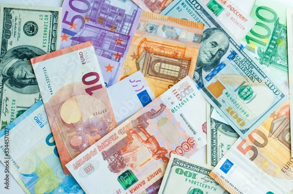 Fototapeta background of money. paper euros, rubles, and dollars. The concept of difference and uniformity of money. For financial journals and articles