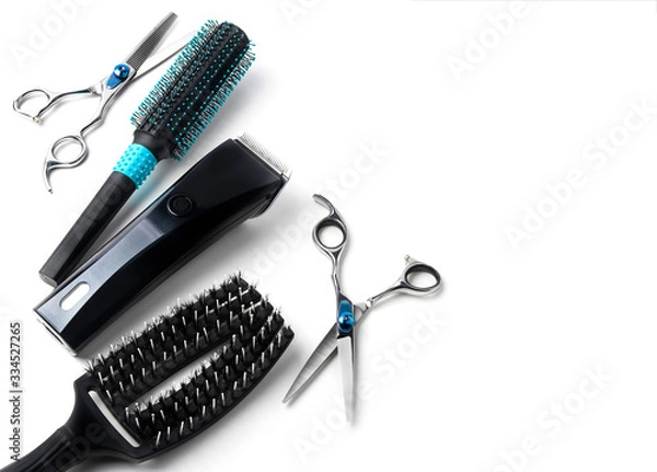 Obraz scissors, hair clipper and combs on white background.
