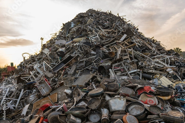 Fototapeta Huge mountain of mainly metal garbage in a junkyard