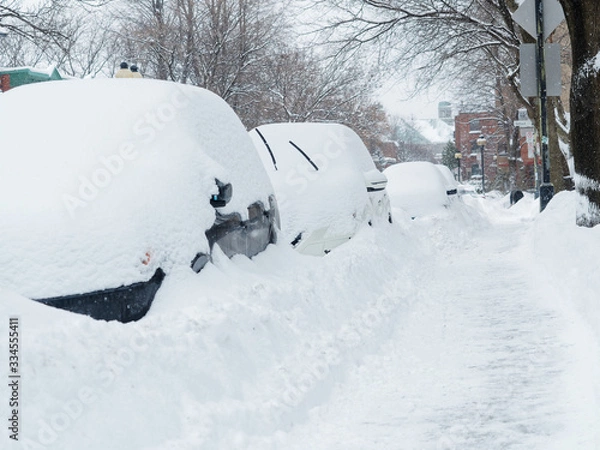 Fototapeta Parked cars on a Montreal street after a heavy snowfall