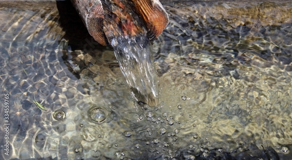 Obraz Water pouring into a drinking trough