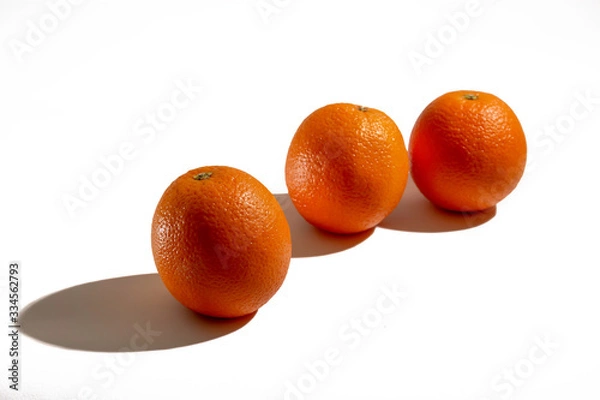 Fototapeta Oranges are on the table.
