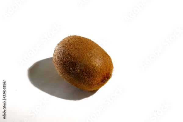 Fototapeta Kiwi fruit is located on a white background.
