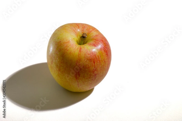 Fototapeta The apple is on the table.