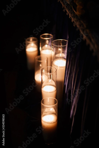Obraz burning candles on a black background