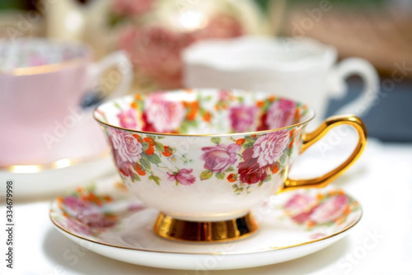 Fototapeta Ornamental tea cup with rose pattern