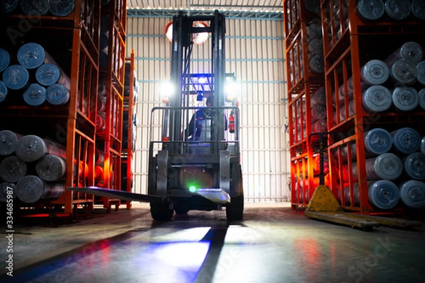 Obraz Forklift loader. Pallet stacker truck equipment textile factory background