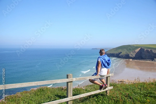 Obraz man walking on a beach