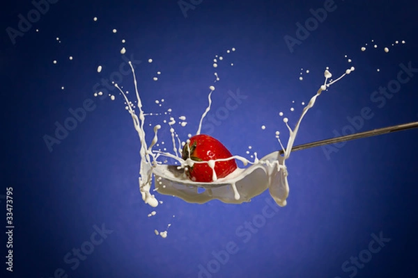 Obraz strawberry splashing in milk