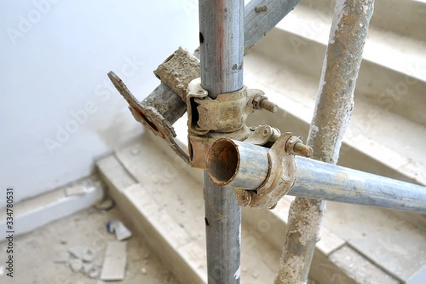 Fototapeta scaffolding assembly at construction site