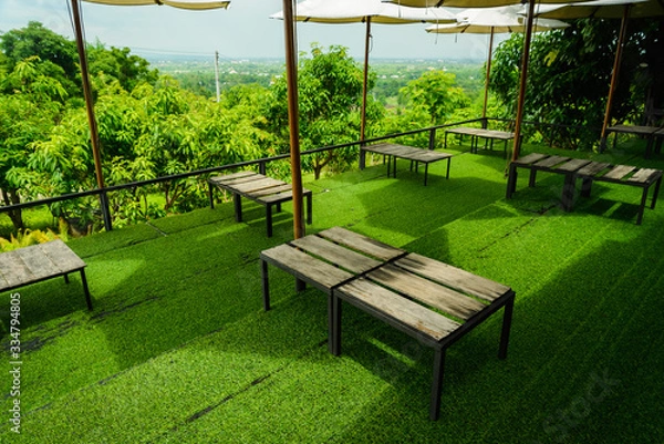 Obraz Wood table on artificial grass