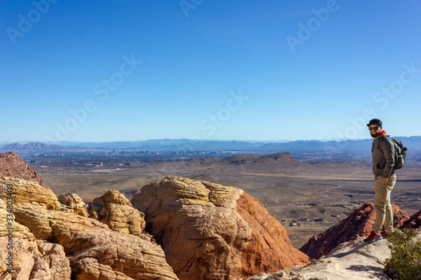 Obraz Las Vegas view smiling man tourist backpacker red rock mountains landscape Red Rock Canyon National Conservation Area Nevada’s Mojave Desert