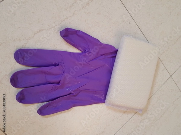 Obraz Closeup of rubber glove and sponge.  Household cleaning tool concept.