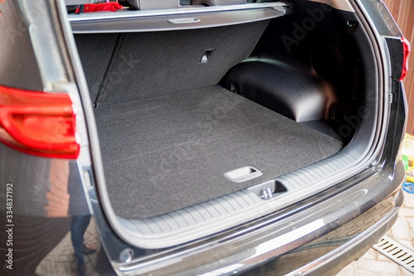 Fototapeta Empty trunk of the suv car ready for being loaded