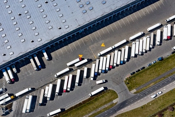 Obraz Aerial drone on trucks and logistic center. Warehouse aerial