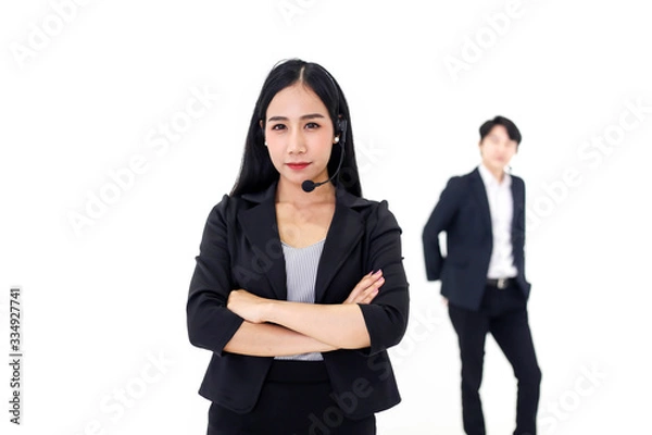 Fototapeta Couple Asia call center workers or Confident business  with headset,Customer support standing on white background.