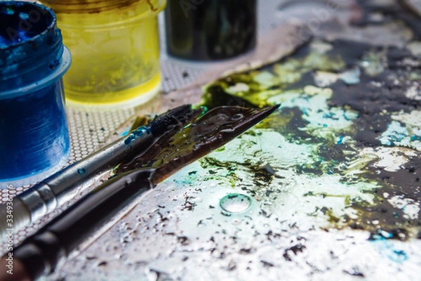 Obraz table and paint brushes, creative process