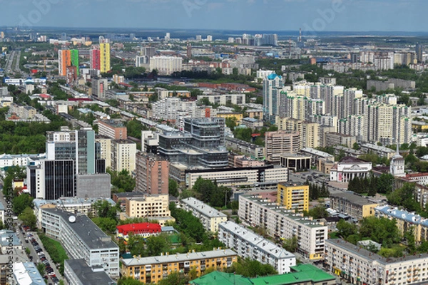 Obraz Yekaterinburg, the capital of the Urals, aerial view. Many beautiful residential and commercial buildings, as well as the architectural ensemble of the city, under the summer sun, top view.