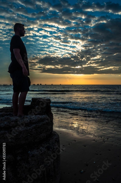 Obraz model on the beach at sunset