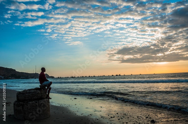 Obraz model on the beach at sunset