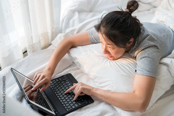 Fototapeta Work from Home concept , woman Self quarantine at home for  social distancing