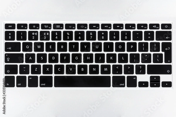 Fototapeta Close up top view on a laptop keyboard with flat buttons