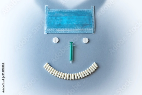 Obraz Syringes and tablets on a blue background. Medical concept