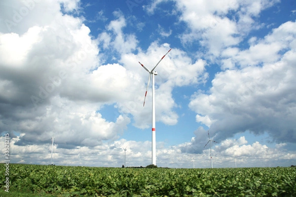 Fototapeta wind turbine on green field
